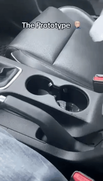 Smart Car Cup Warmer from My Store, showing a close-up of the device holding a coffee cup in a vehicle interior.shop_this_look_AVdw3f